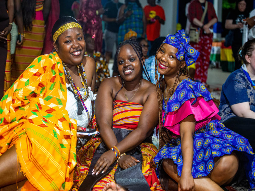 3 girls attending Kusafiri 2023 at the international night